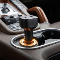 TWM Car Charger Lite plugged into a car socket, tracking the vehicle while it charges your phone
