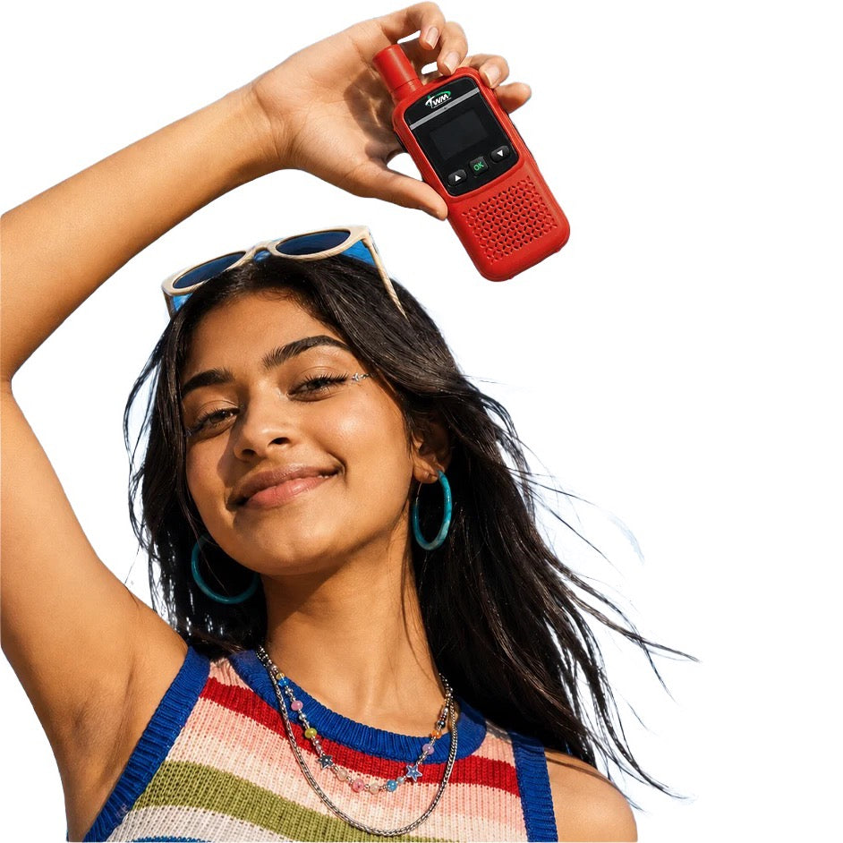 Woman holding a red TWM Talkie above her head